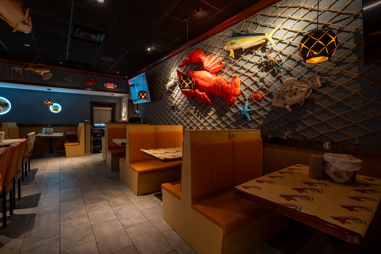 A restaurant dining room with sculptural wall decor