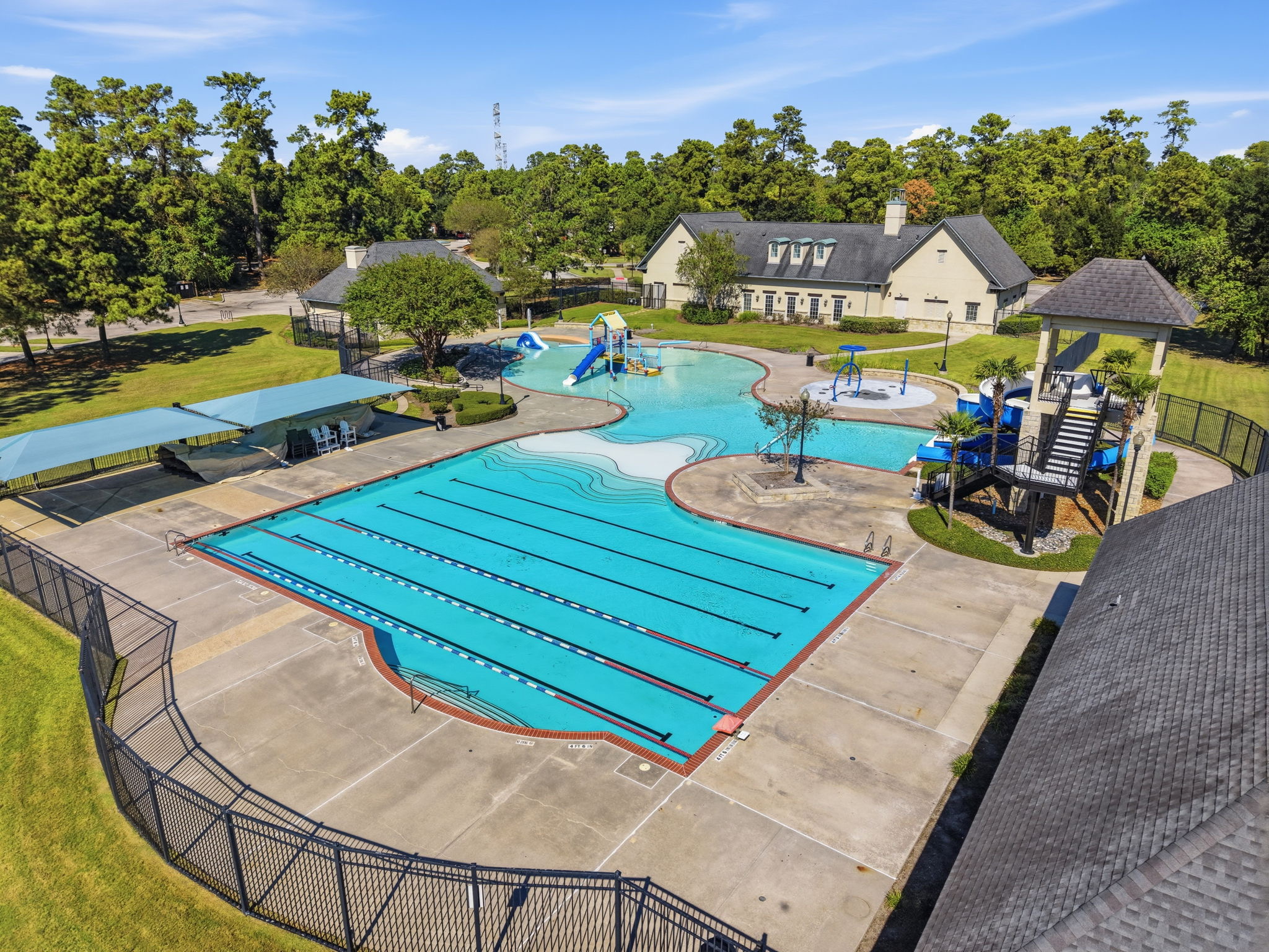 Overhead view of outdoor swimming pools and surrounding recreation areas