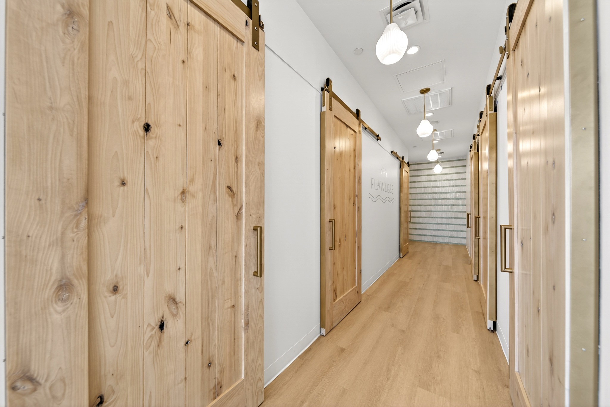 Wood lined corridor leading to treatment rooms